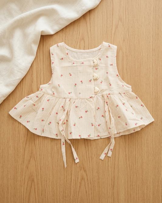 Blush Blooms: Toddler Girls' Cream Peplum Top with Heart Buttons & Side Ties