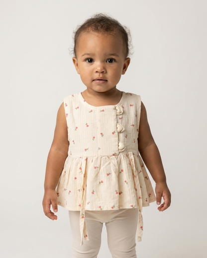 Blush Blooms: Toddler Girls' Cream Peplum Top with Heart Buttons & Side Ties