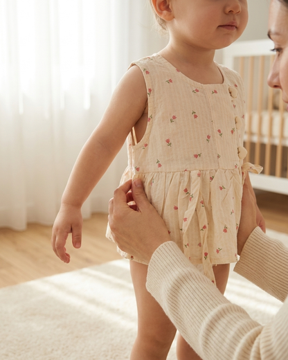 Blush Blooms: Toddler Girls' Cream Peplum Top with Heart Buttons & Side Ties